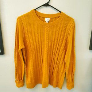 On trend mustard colored cable knit sweater